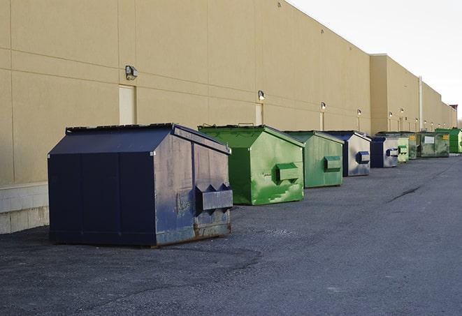 a yellow construction dumpster filled with waste materials in Adair Village OR